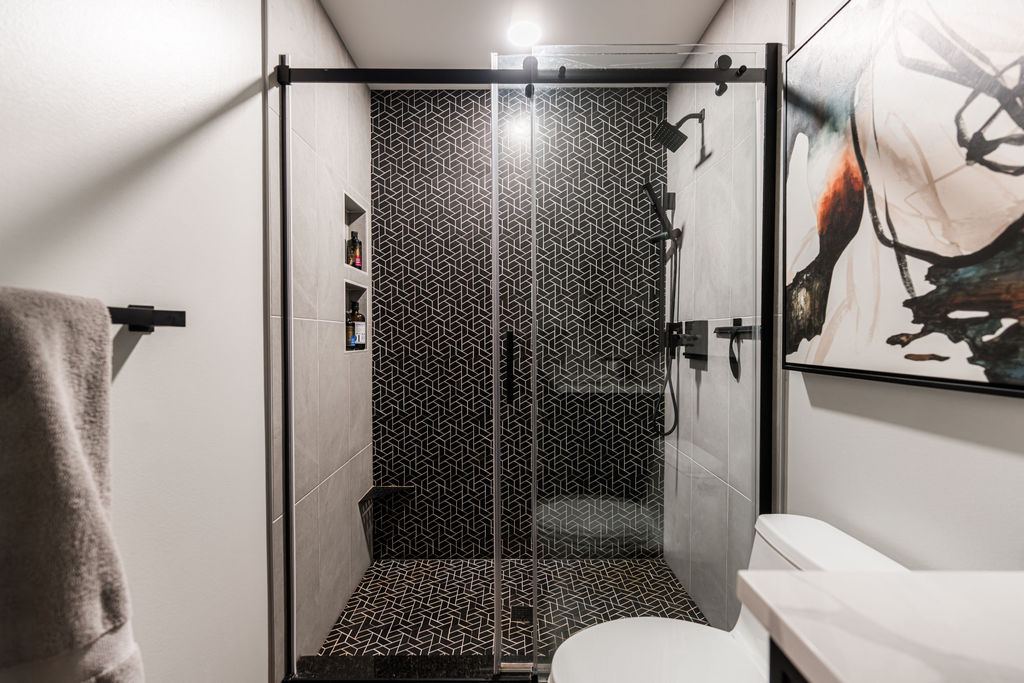 Alyssa Naperville — office or flex space with dark moody walls, built-in storage, and natural light