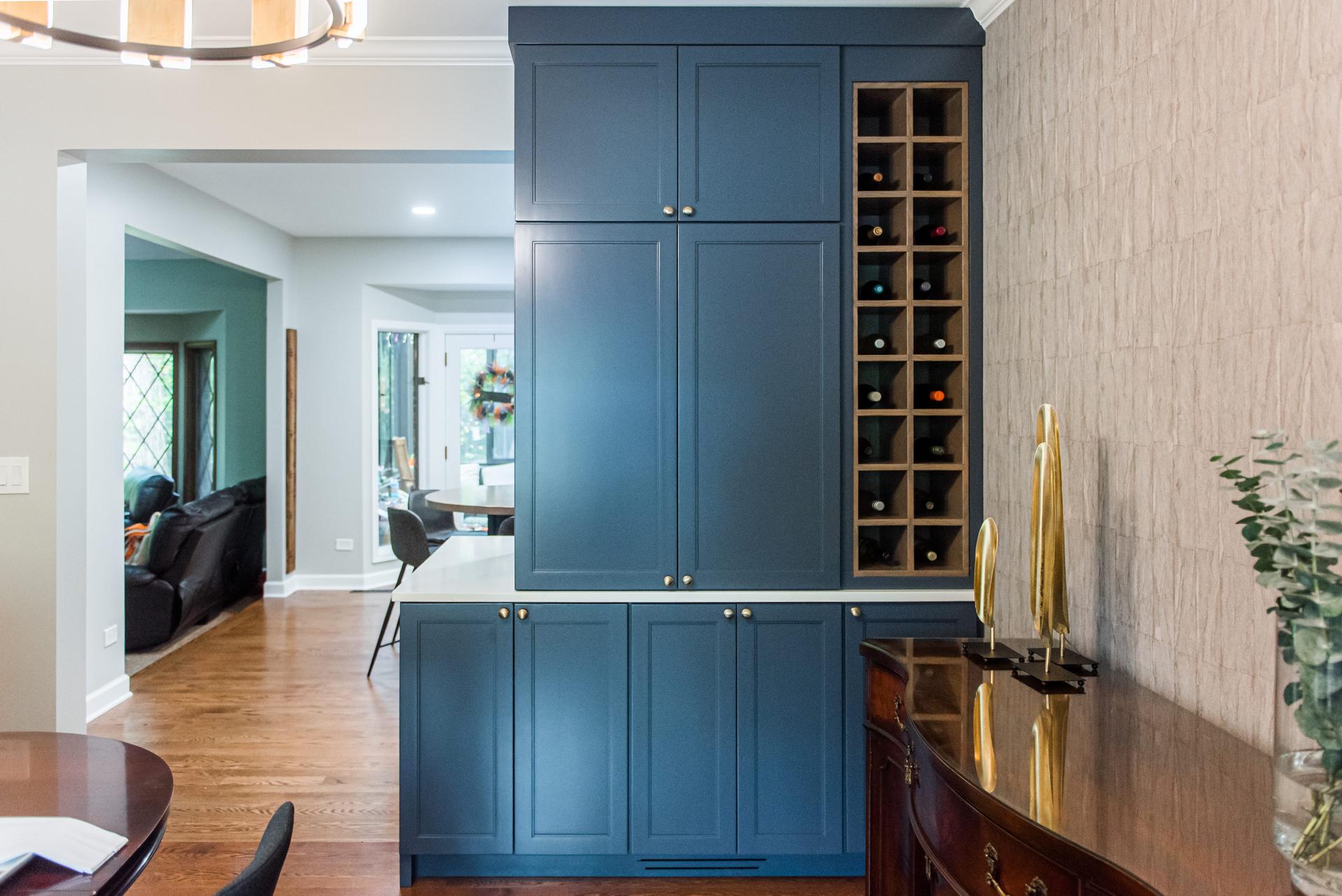 Navy butler's pantry column with integrated wine rack and brass hardware — Eastcliff Shorewood IL by SilverBullet Inc.