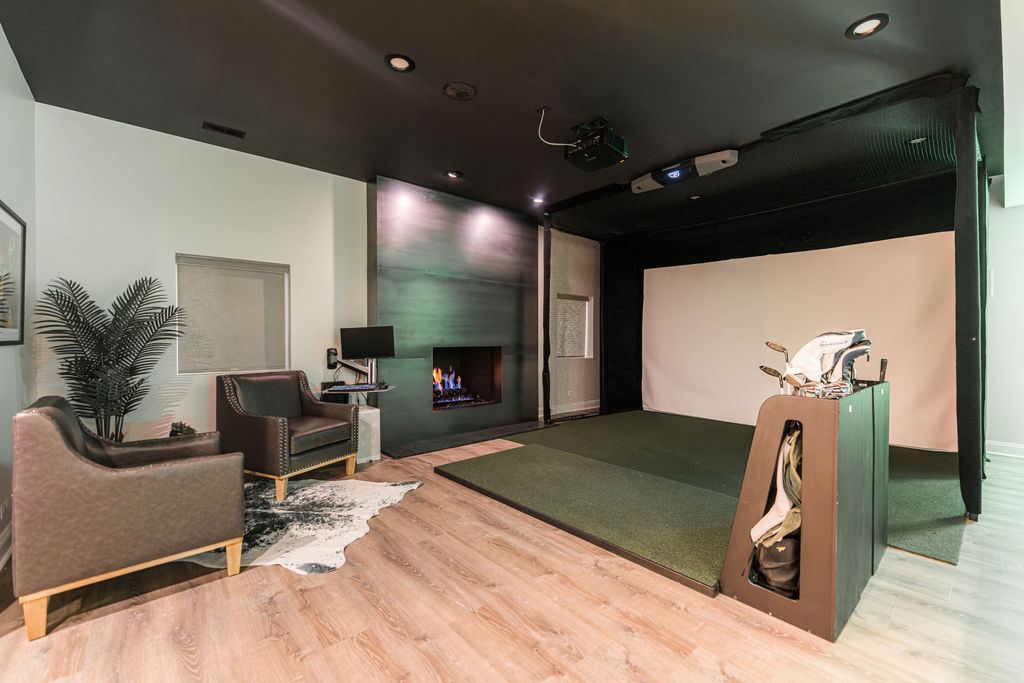 Hickory St. Charles — custom bar with bar seating area and view toward golf simulator room