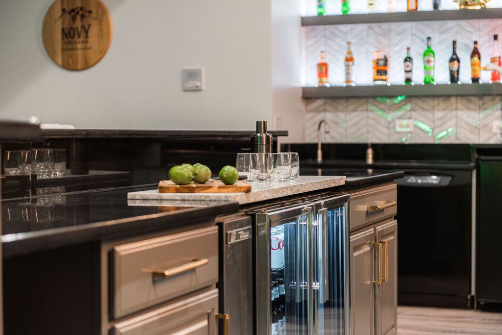 Hickory St. Charles — golf simulator room entry with dark ceiling, artificial turf, and projector screen