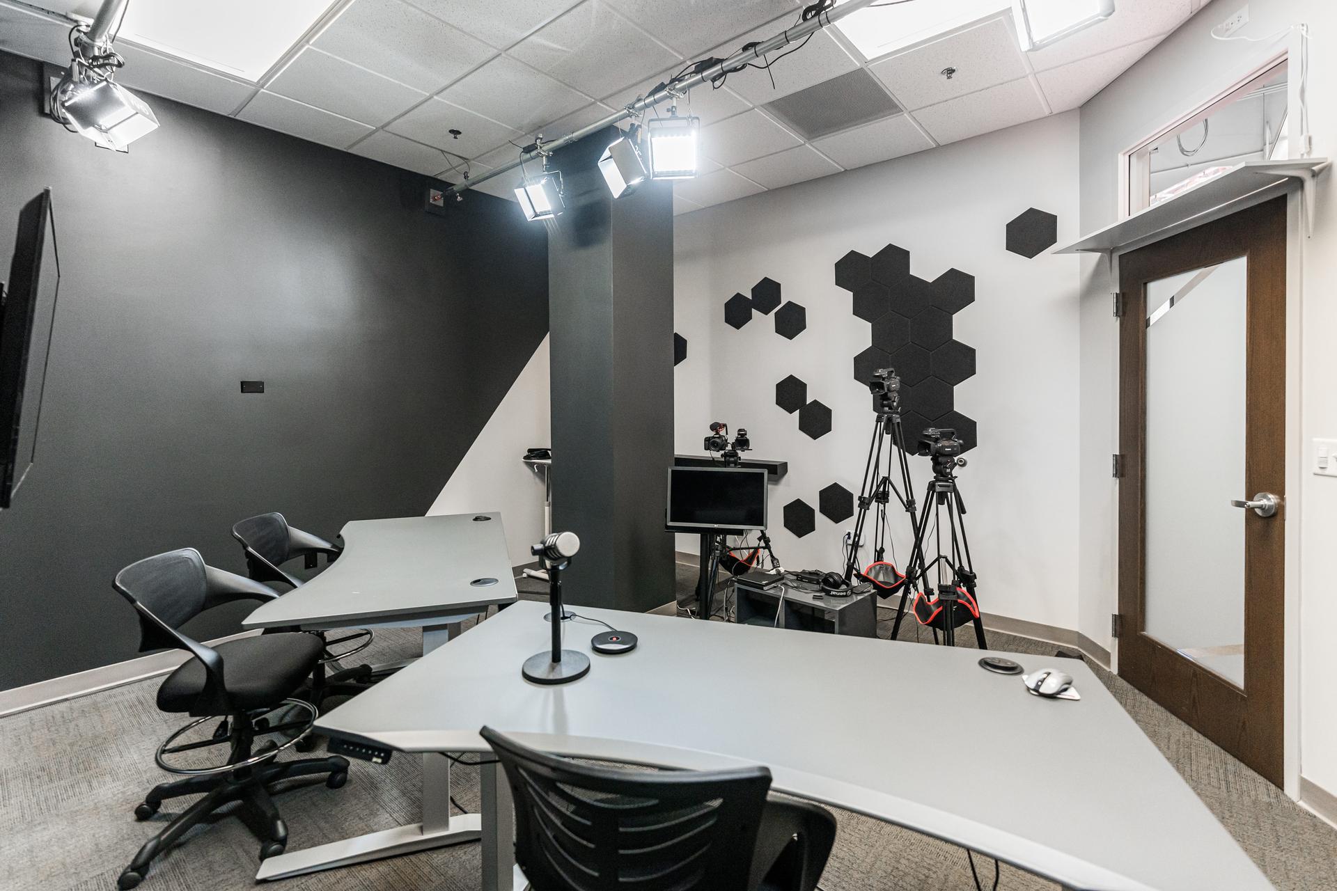 Professional podcast and video production studio with acoustic panels and broadcast lighting — MRG Naperville