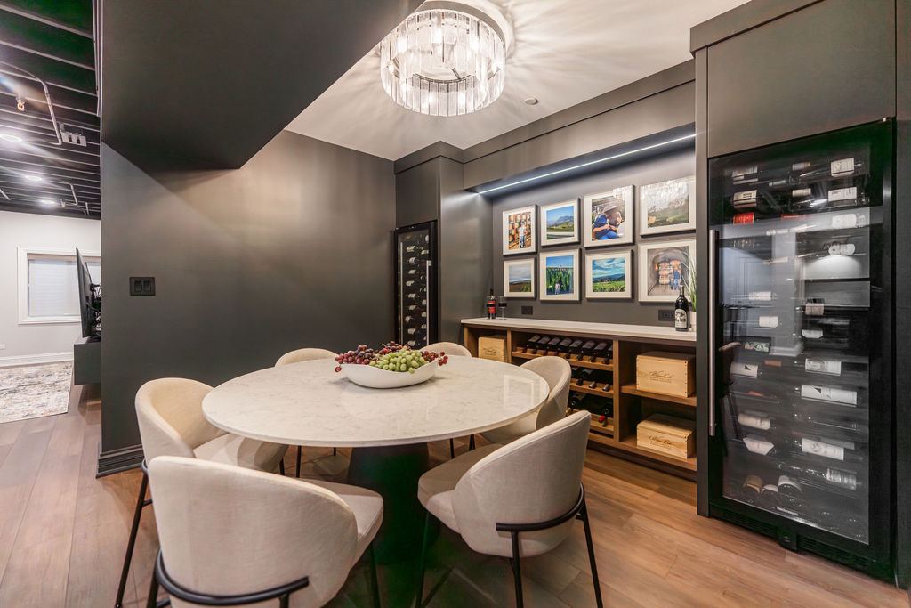 Yorkshire Oakbrook — custom wet bar with forest green shaker cabinetry and brass hardware
