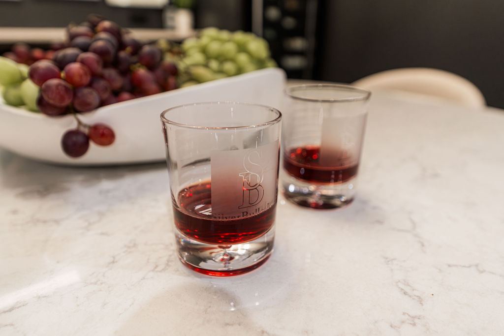 Yorkshire Oakbrook — SilverBullet branded glassware on marble bar countertop detail