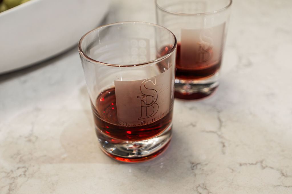 Yorkshire Oakbrook — bar finish detail with brass fixtures and custom cabinetry close-up